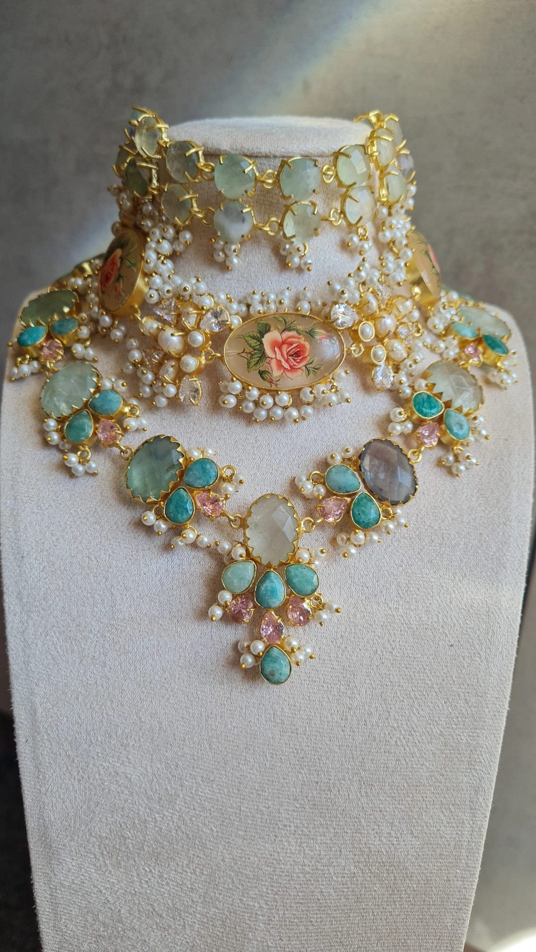 Naavi statement choker set with pastel stones, pearls, and a floral cameo centrepiece